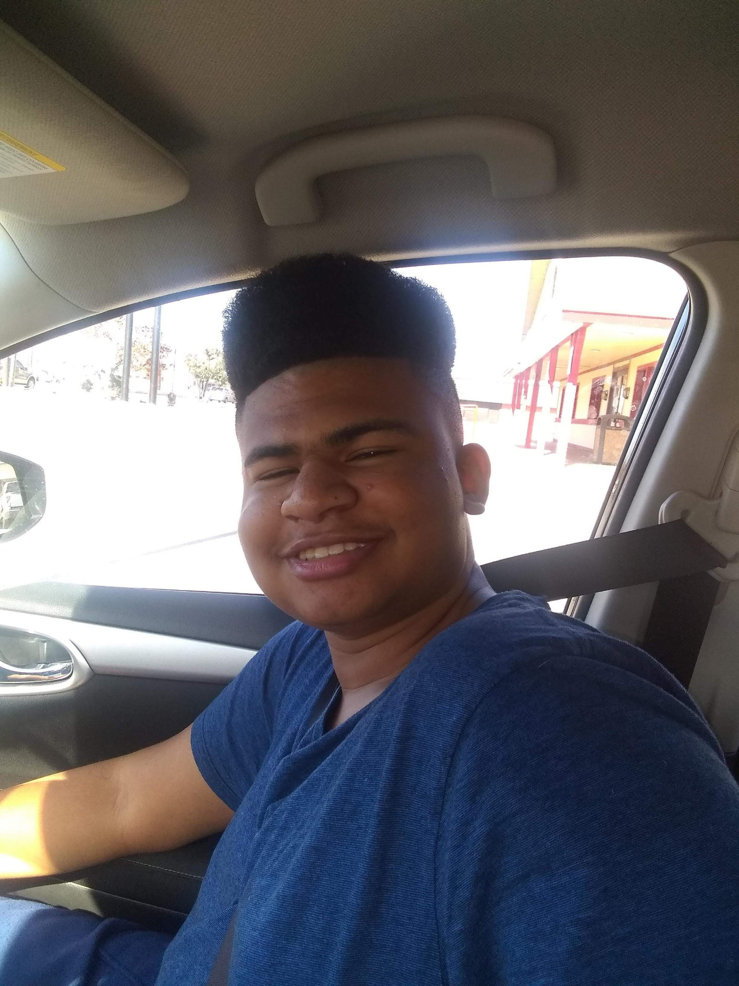 Jaiden smiling in the car