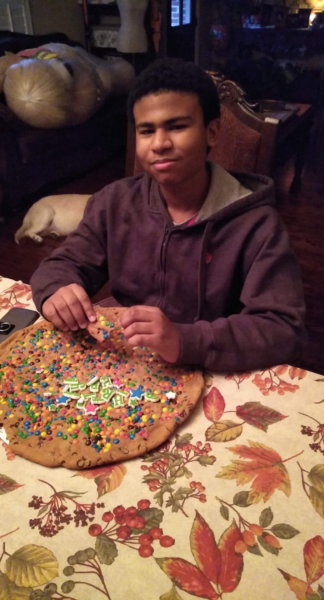 Jaiden decorating a giant birthday cookie